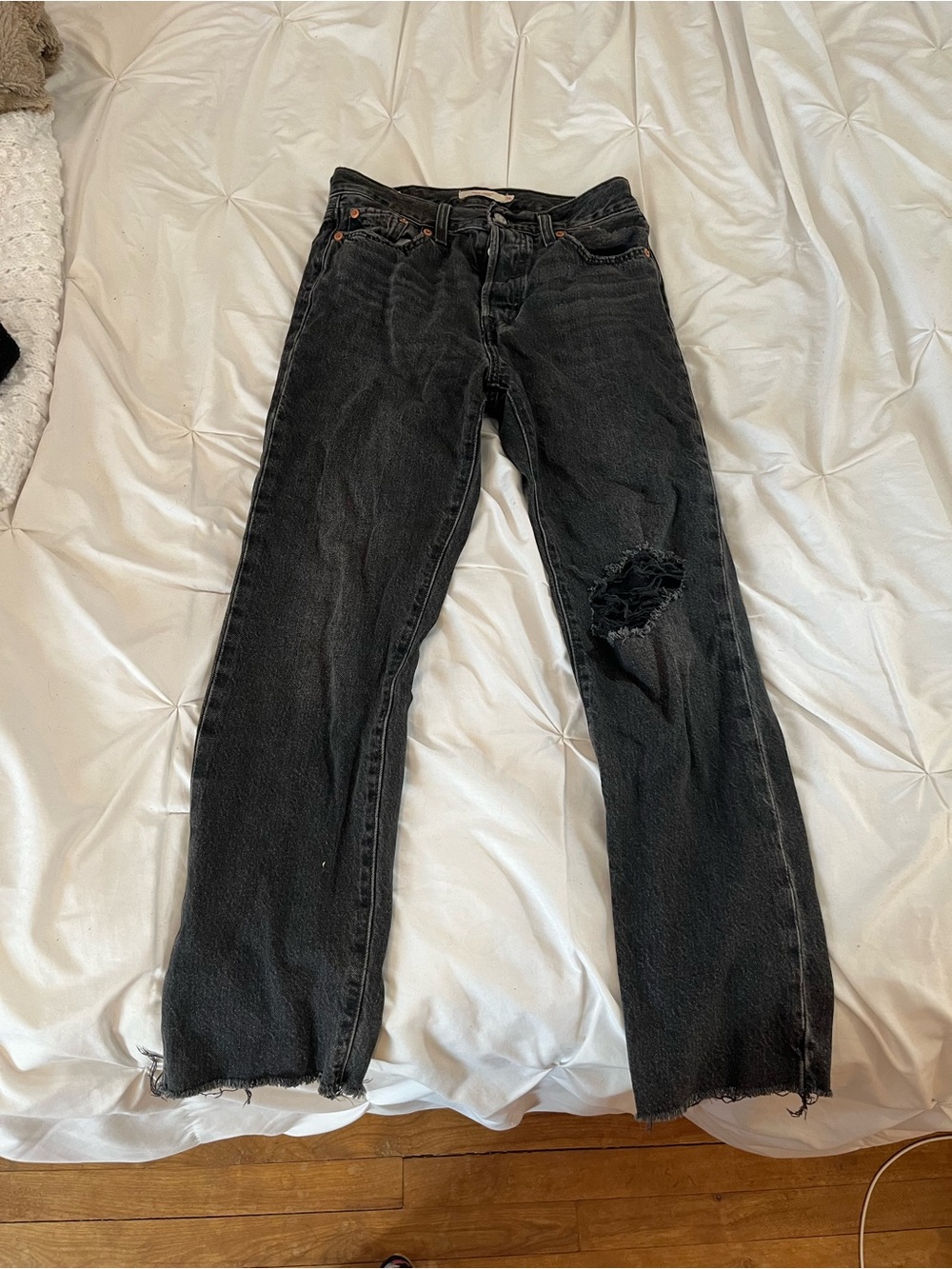 black distressed Levi’s jeans